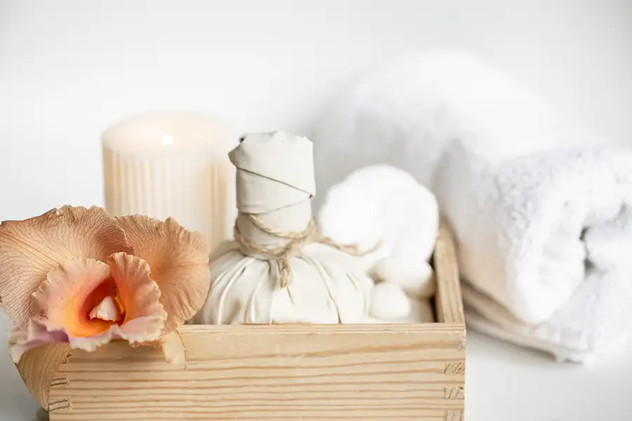  Beautiful upscale spa interior with soft towels, candles, and a serene feminine atmosphere, showing a luxurious non-clinical beauty experience